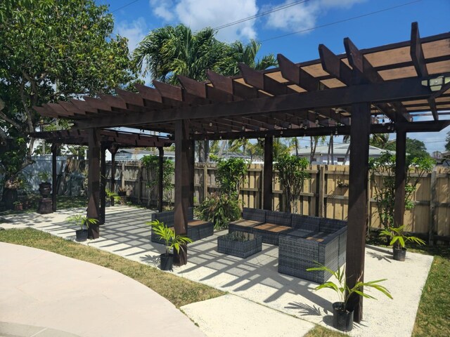 10611 SW 164th St, Miami, FL 33157 - fenced backyard with an outdoor hangout area, a patio, and a pergola
