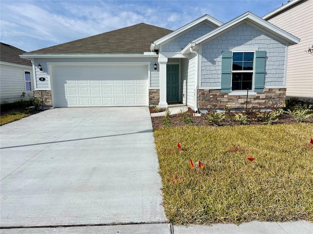 view of front of property featuring a front yard and a garage