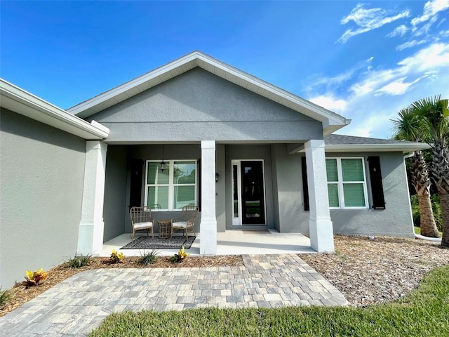 entrance to property with covered porch