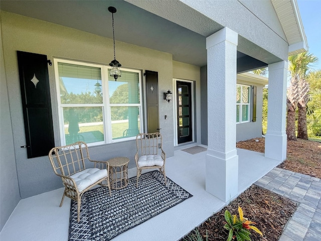 entrance to property featuring a porch