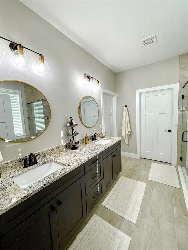 bathroom with vanity and an enclosed shower