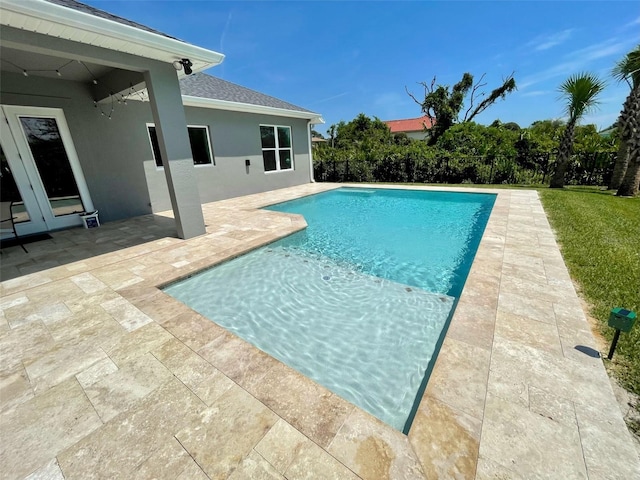 view of swimming pool featuring a patio