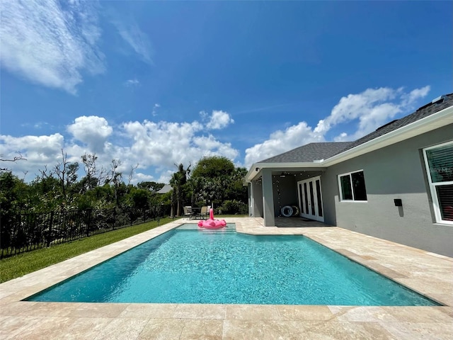 view of swimming pool featuring a patio area