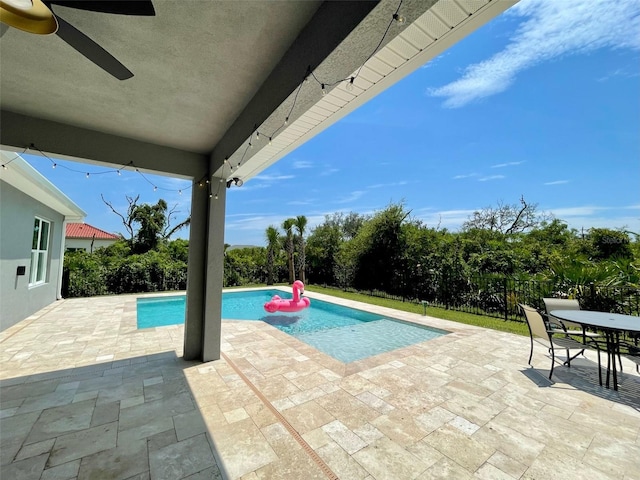 view of swimming pool with a patio area and ceiling fan