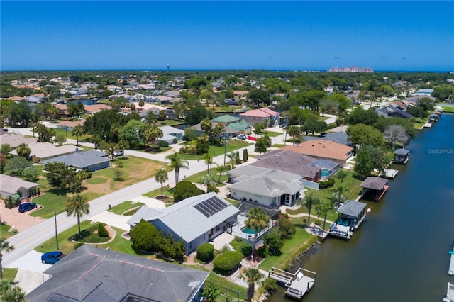 bird's eye view with a residential view and a water view