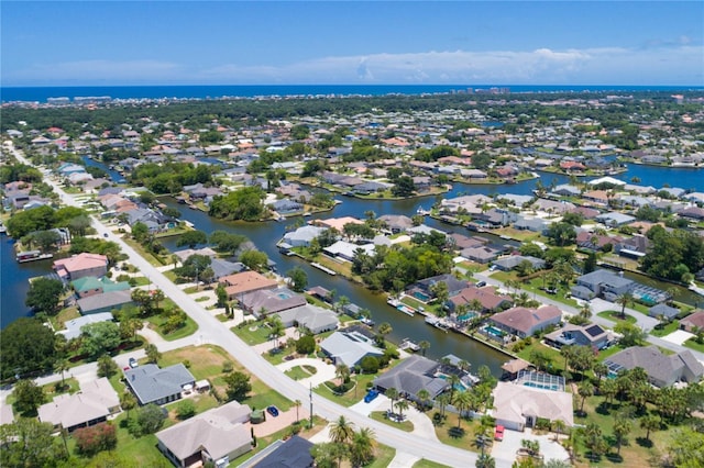 birds eye view of property featuring a residential view and a water view