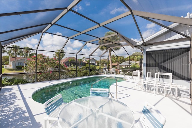 view of pool featuring a lanai and a patio