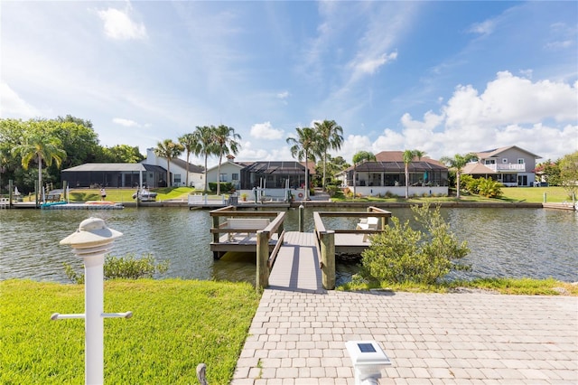 view of dock featuring a residential view and a water view