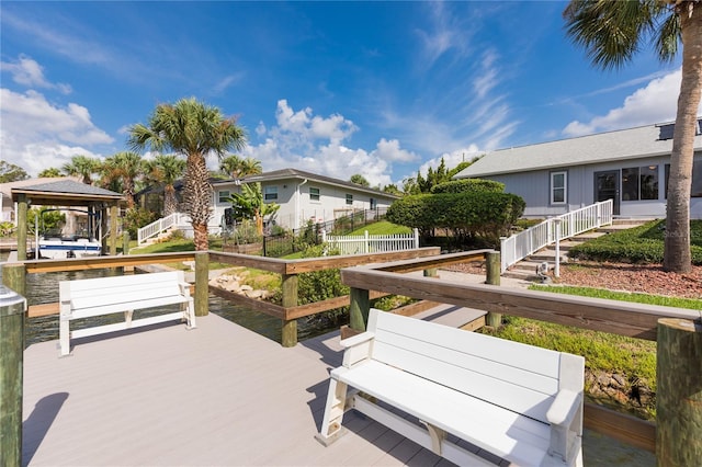 exterior space featuring a gazebo and fence