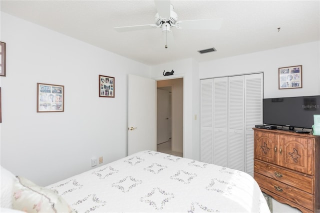 bedroom featuring ceiling fan and a closet