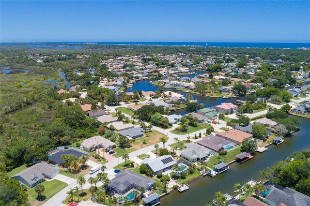 birds eye view of property featuring a residential view and a water view