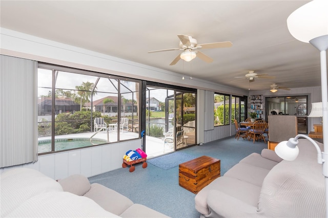 living room featuring ceiling fan and carpet flooring