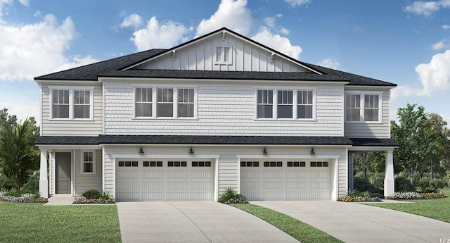 view of front of property featuring a front lawn and a garage