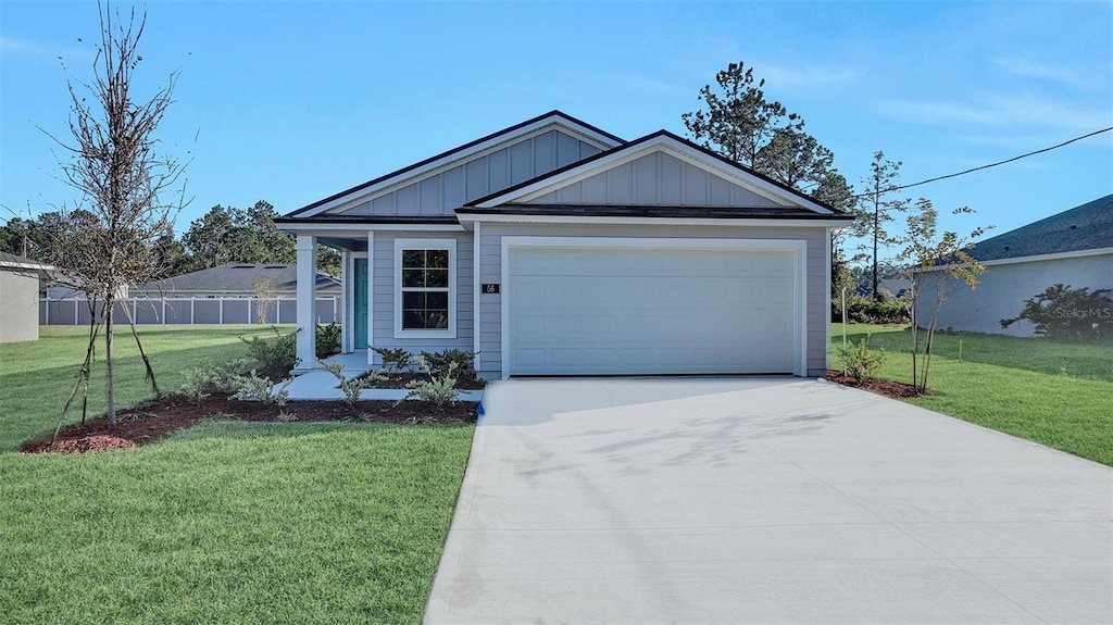 view of front facade with a garage and a front yard