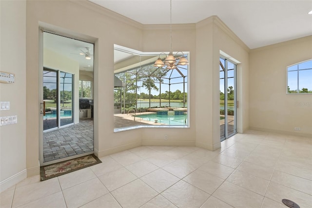 doorway with light tile patterned floors, crown molding, and a healthy amount of sunlight