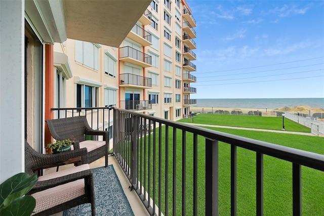 balcony featuring a water view