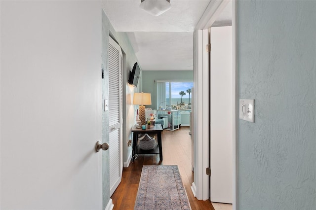 corridor featuring hardwood / wood-style flooring