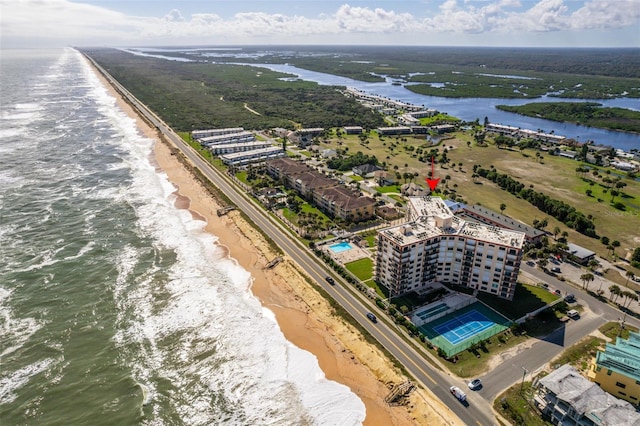 aerial view featuring a water view and a beach view