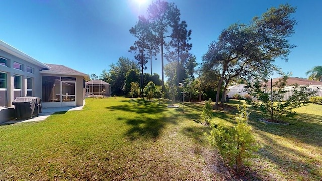 view of yard with a sunroom