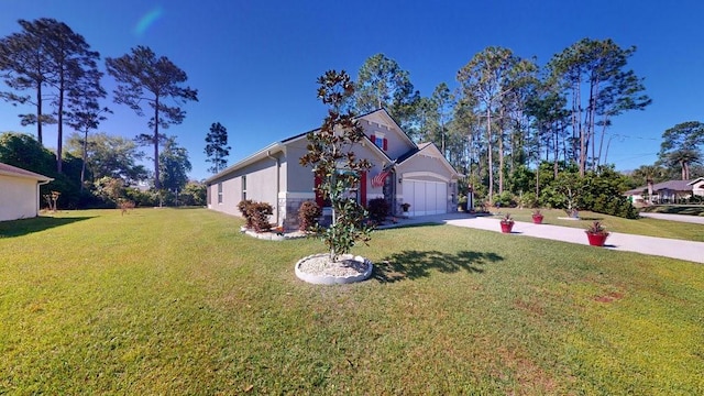 view of front of house with a front yard and a garage