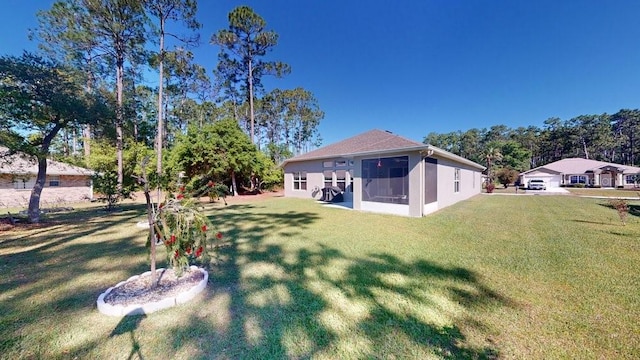 view of yard featuring a sunroom