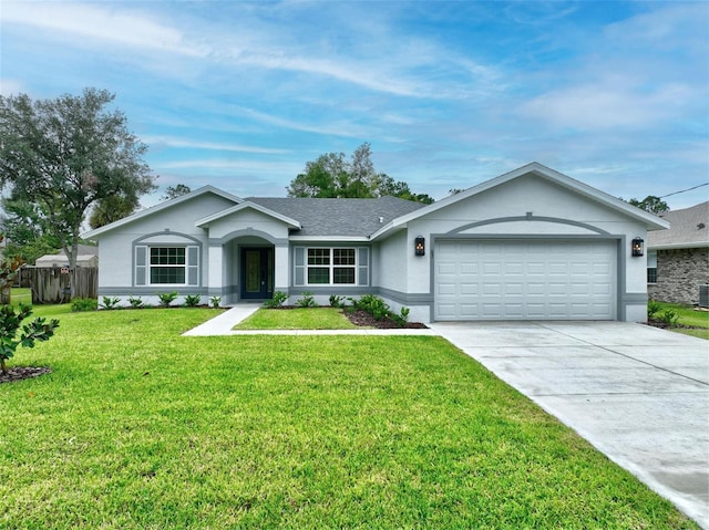 ranch-style house featuring a garage and a front lawn