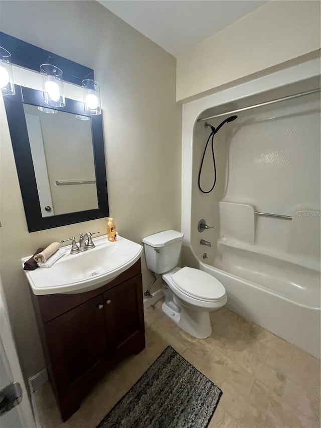 bathroom featuring toilet, bathing tub / shower combination, and vanity