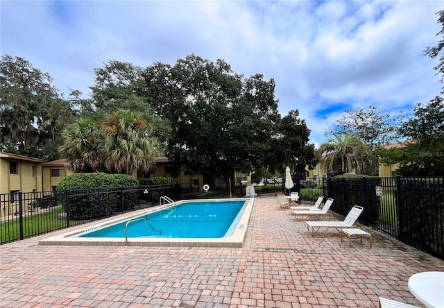 view of swimming pool featuring a patio area