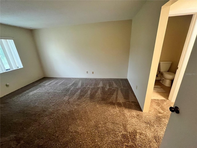 interior space with dark colored carpet