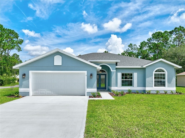 single story home with a front yard and a garage