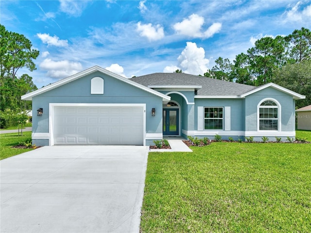 ranch-style house featuring a front lawn and a garage