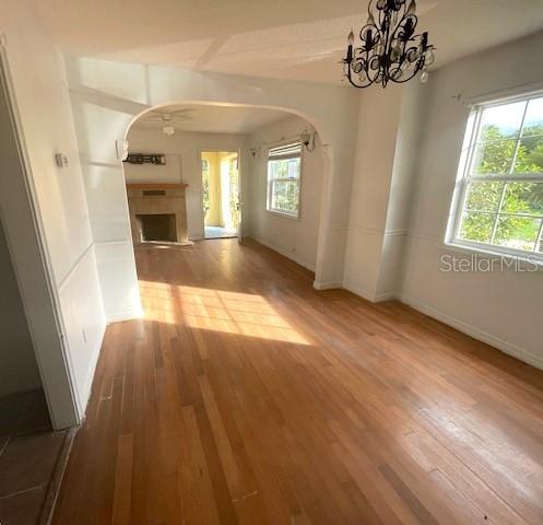 interior space featuring a chandelier, hardwood / wood-style flooring, and a wealth of natural light