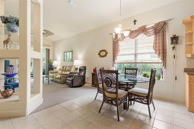 dining space featuring light colored carpet and a chandelier