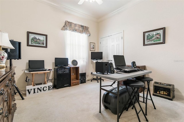 carpeted home office featuring ceiling fan and ornamental molding