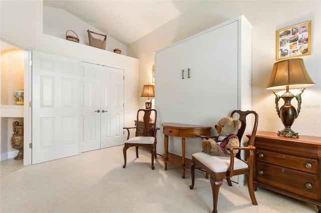 sitting room with vaulted ceiling