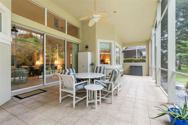 sunroom / solarium featuring ceiling fan