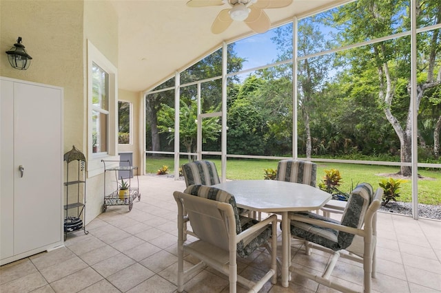 sunroom featuring ceiling fan and lofted ceiling