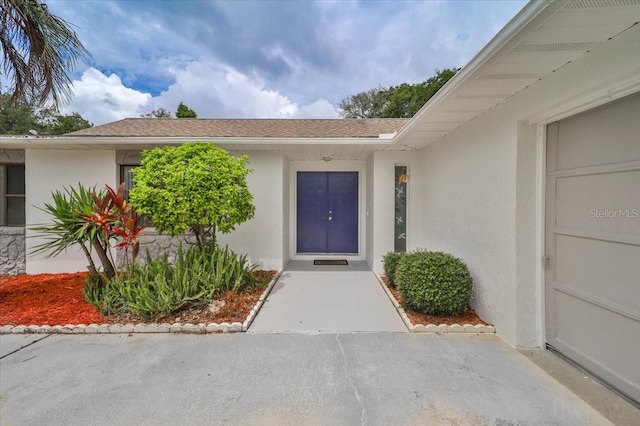 entrance to property featuring a garage