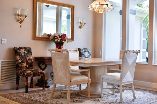 dining area with a notable chandelier