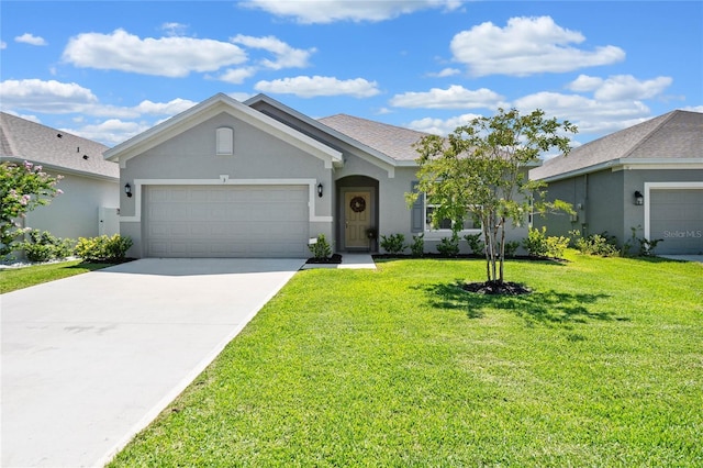 ranch-style home with a garage and a front lawn