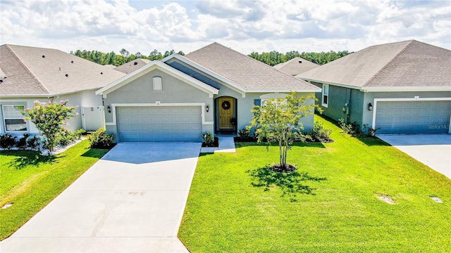 ranch-style home with a garage and a front lawn