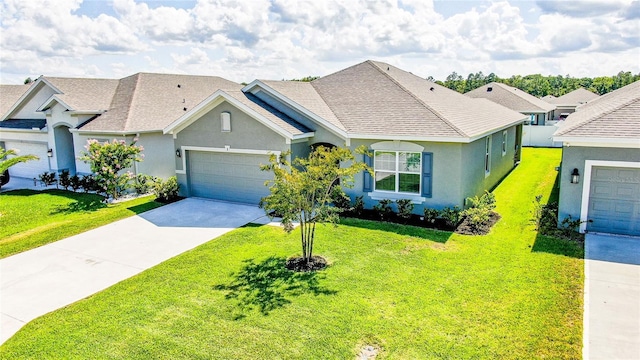 single story home with a front yard and a garage