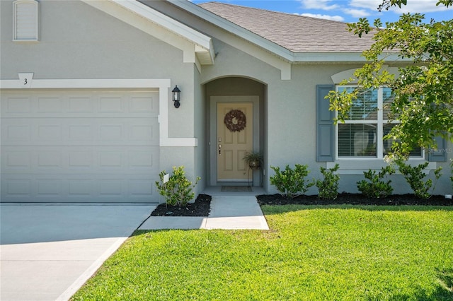 property entrance featuring a lawn and a garage