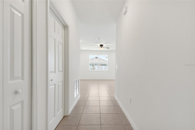 hallway with light tile patterned floors