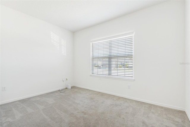 empty room featuring light colored carpet