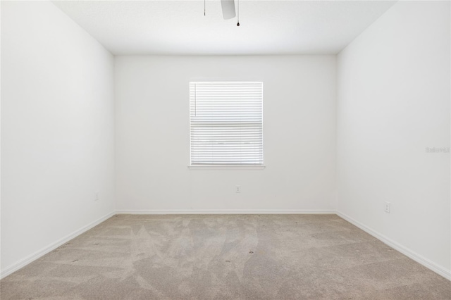 unfurnished room with light carpet