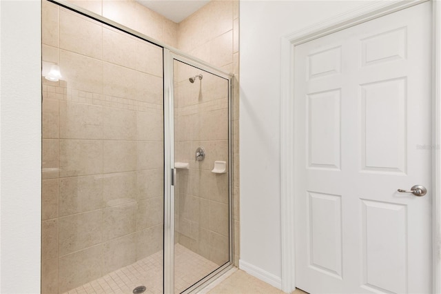 bathroom featuring an enclosed shower