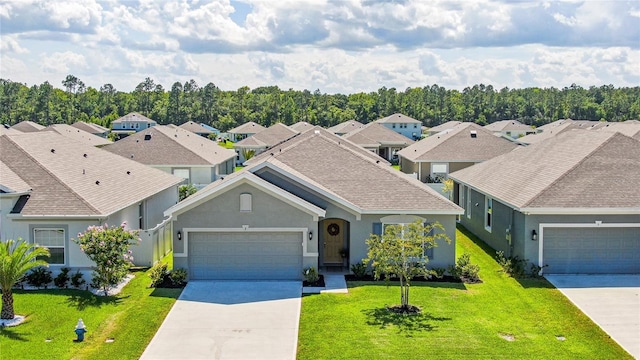 view of front of property featuring a garage and a front yard