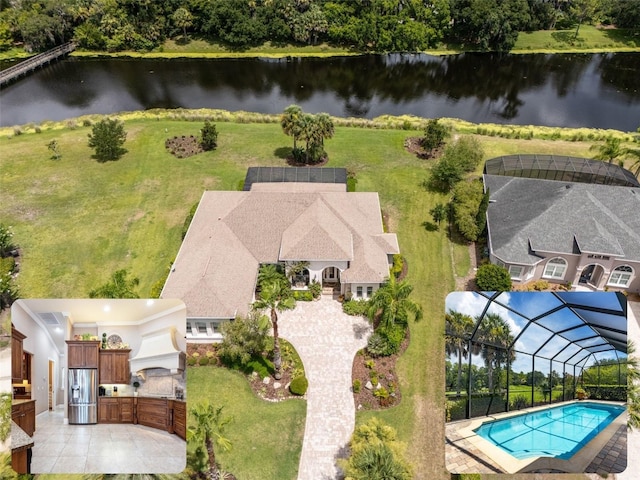 birds eye view of property featuring a water view