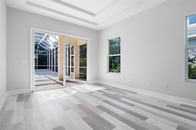 empty room with a raised ceiling